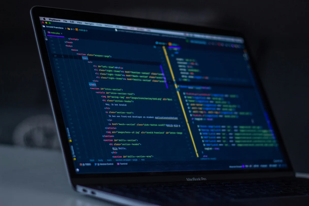 A laptop running browser developer tools inspecting a page